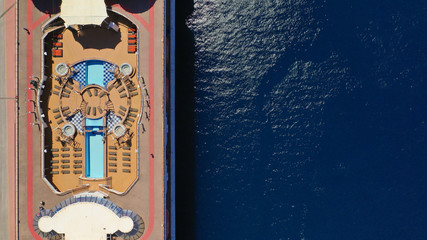 Aerial drone photo of huge luxury cruise liner docked in Mediterranean port