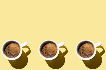 coffee on a yellow background, a lot of coffee cups, pattern