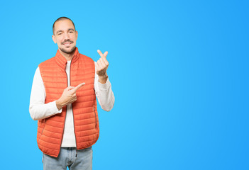 Young man making a gesture of worried about his economy