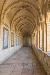 Fototapeta na wymiar JERUSALEM, ISRAEL - January 30, 2020; The gothic corridor of atrium in Church of the Pater Noster on Mount of Olives. Israel.