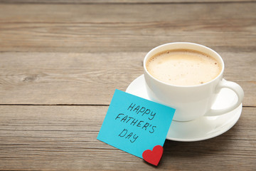 Fathers Day message with coffee cup on grey wooden background