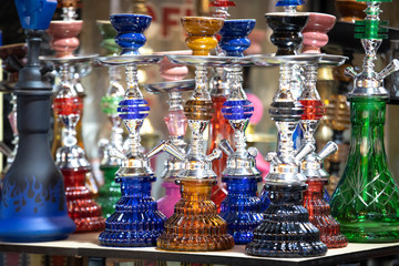 New hookahs for sale on the counter. A photo was taken in front of the store. Close up.