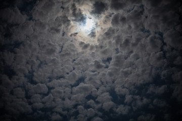 Cloudy sky with the moon in the center - 347265952