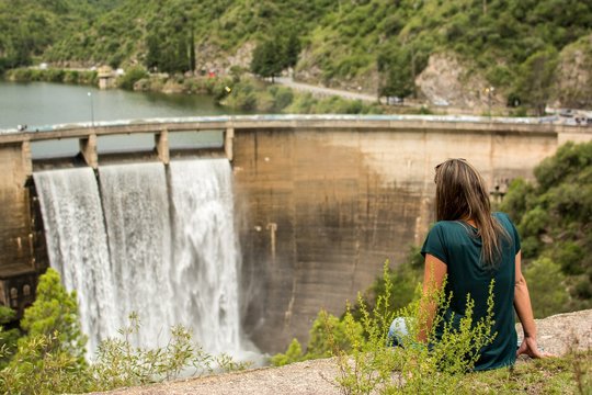 Rear View Of Woman Looking At Dam