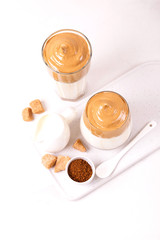 whipped dalgona coffee with milk and cane sugar. South Korean summer drink