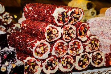 Traditional "lokum rolls" a sweet dessert turkish delights, pastry with different flavours