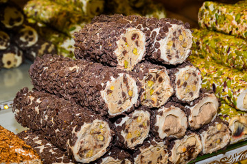 Traditional "lokum rolls" a sweet dessert turkish delights, pastry with different flavours