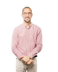 Happy young man posing against background