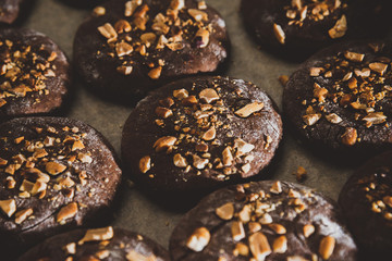 Cookies with nuts on baked on the baking sheet. Cookies close-up cooked in a bakery of a...