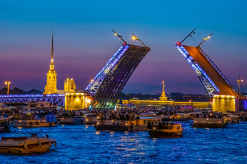 Fototapeta premium Saint Petersburg. Russia. Palace bridge. Drawbridges of St. Petersburg. White nights in St. Petersburg. Motor ships sailing along the Neva. Peter-Pavel's Fortress. Night Neva. Traveling in Russia
