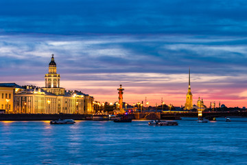 Obraz premium Saint Petersburg panorama. Russia. White nights in Petersburg. Embankment of St. Petersburg view from the Neva. Peter and Paul Fortress. Rostral columns. Night panorama of the Neva. Cities of Russia