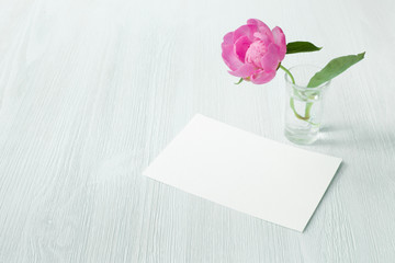 Peony flowers decoration and invitation card. Greeting card and white provence interior. Clean scandinavian style decoration.