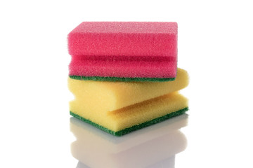 Obraz na płótnie Canvas Colorful sponge isolated on kitchen white background. Clean supplies equipment. Household cleaner service.