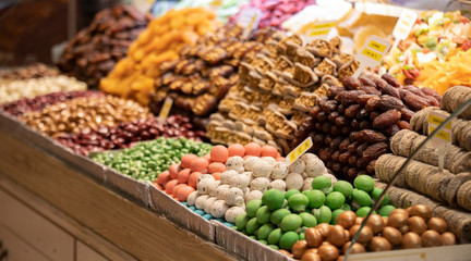 Colorful candies. A photo was taken from the side. Apart from sugar, there is almond content. Close-up.