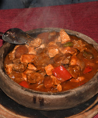 Home cooked lamb and beef or pork stew, served in a traditional restaurant, in wooden bowl