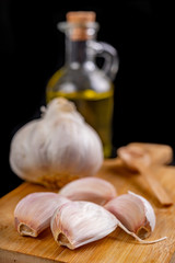 Healthy garlic and syrup on a wooden board. Natural methods of preventing colds.