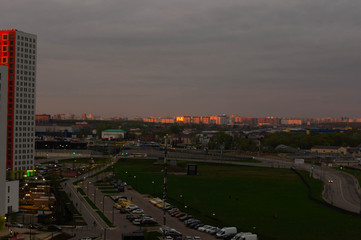 Fototapeta premium new buildings of Moscow city, Salaryevo district at sunset