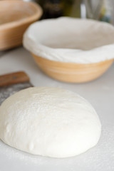 Homemade freshly prepared dough for fresh healthy bakery and pastry on a white kitchen table.
