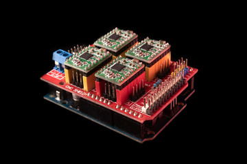 CNC shield. Arduino UNO board on black background, close up. Microcontroller for programming and prototyping.