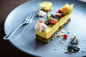 Cheese cake with fresh berries and meringue cookie
