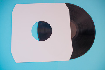 Vinyl record isolated against blue background
