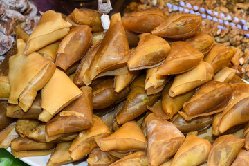 Turkish specific dessert with nuts walnuts and honey, pastry named fistikli muska.