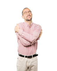 Happy young man doing a hug gesture