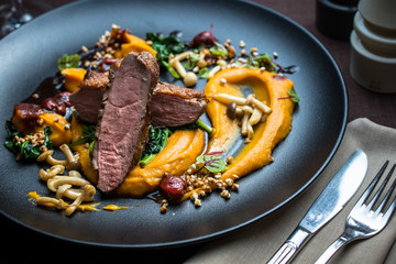 Grilled duck breast with vegetables, mushrooms