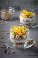 Healthy meal made of granola, yogurt and fruits. Delicious food for breakfast.