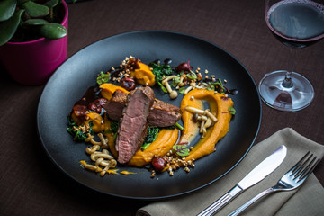 Grilled duck breast with vegetables, mushrooms