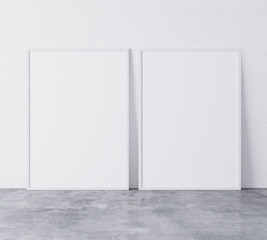 Set of 2 white vertical modern frames A3, A4, frame mock up on white wall standing on gray floor. Poster mock up. minimal frames. Empty frame Indoor, 3D render
