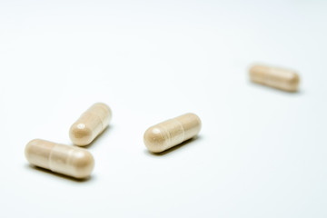 Pills over white background.