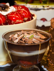 Chocolate rice pudding, dessert in a glass transparent bowl served in a restaurant.