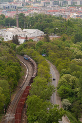Naklejka premium passing train on tracks in the forest in the capital of the Czech Republic Prague