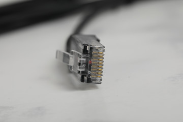 An black ethernet cable isolated on a white background