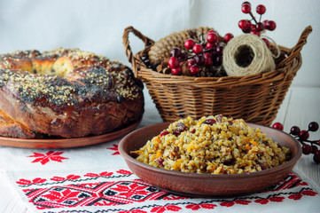 Ukrainian Christmas food with kuttya and Kalach with vyshyvanka
