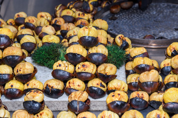 Roasting chestnuts on a street stall in Istanbul, Turkey. Selective focus.