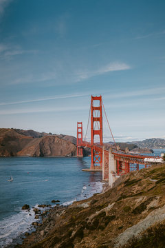 Photo of a gorgeous national monument and landmark Golden Gate Bridge in San Francisco during the sunset
