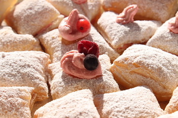 Homemade phyllo pastry dessert with cream and powdered sugar on top