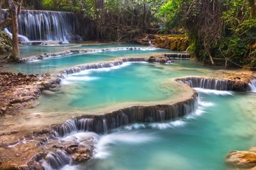 Scenic Kuang Si Falls Landscape, a beautiful cascading Waterfall in a Lush Forest Setting near Luang Prabang, Laos Southeast Asia