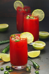 Jalapeno tomato margarita cocktail with lime