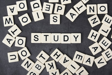 A word Study formed with plastic letter tiles