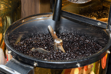 Antique coffee grinder with coffee beans, various types: dark black, brown, green specialty