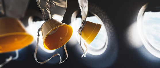 3D illustration of oxygen masks inside an airplane