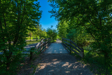 Promenade on Lake Monticolo in the municipality of Appiano on a wine road near Bolzano in Italian South Tyrol.