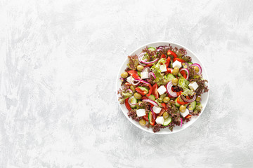 Obraz na płótnie Canvas Greek salad with fresh vegetables, lettuce and feta cheese
