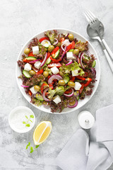 Greek salad with fresh vegetables, lettuce and feta cheese