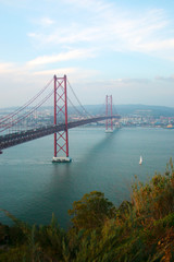 View of 25th of April Bridge, a suspension bridge connecting the city of Lisbon, capital of Portugal, to the municipality of Almada on the left (south) bank of the Tagus river. Lisbon, Portugal
