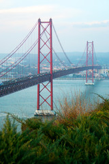 View of 25th of April Bridge, a suspension bridge connecting the city of Lisbon, capital of Portugal, to the municipality of Almada on the left (south) bank of the Tagus river. Lisbon, Portugal