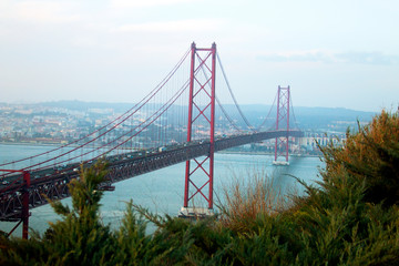View of 25th of April Bridge, a suspension bridge connecting the city of Lisbon, capital of Portugal, to the municipality of Almada on the left (south) bank of the Tagus river. Lisbon, Portugal